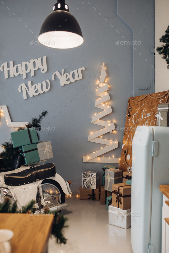 Appetizing cupcakes and mug on table serving Christmas decoration at cosiness room interior - Stock Photo - Images