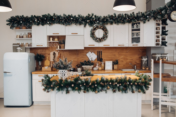 Beautiful white kitchen decorated for Christmas. Christmas holidays - Stock Photo - Images