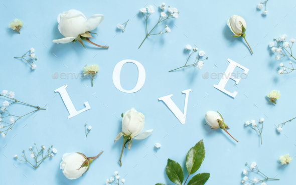 Flowers And Word Love On A Light Blue Background Stock Photo By