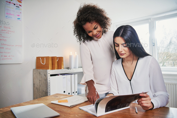Two young women running a small business - Stock Photo - Images