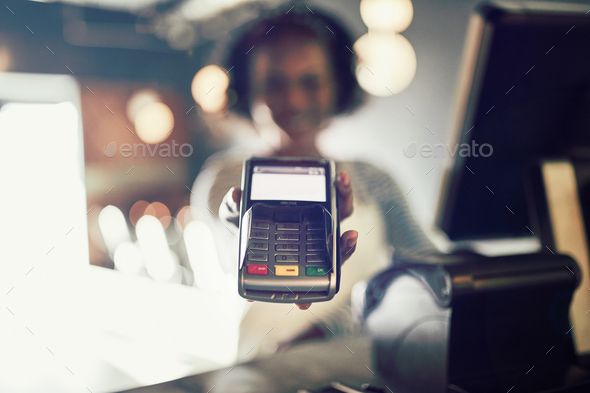 Restaurant waitress holding an electronic card payment machine - Stock Photo - Images