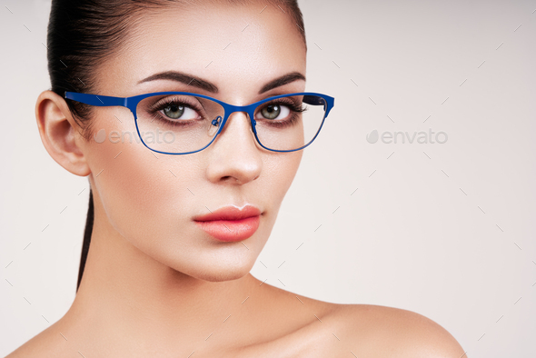 Woman with long eyelashes in eyeglasses - Stock Photo - Images