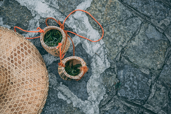 Freshly collected green tea leaves in wicker bowls - Stock Photo - Images