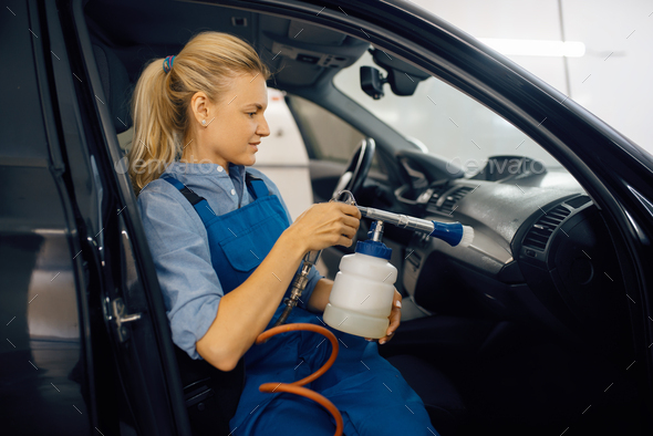 Female washer, view through the windshield - Stock Photo - Images