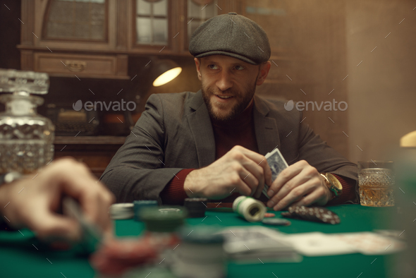 Professional poker player feels the risk, casino - Stock Photo - Images