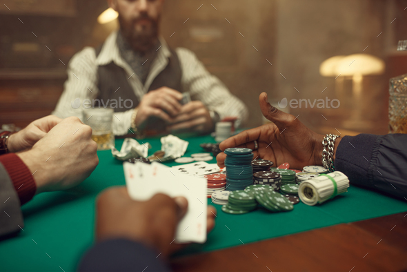 Male poker players at gaming table, casino - Stock Photo - Images