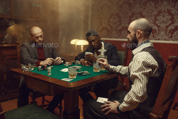 Male player cheating in poker - Stock Photo - Images