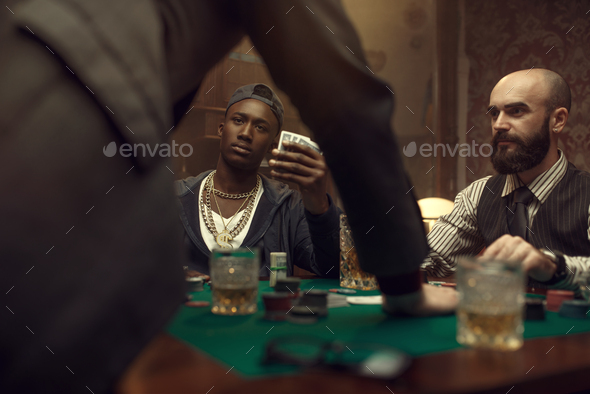 Three poker players in casino, blackjack - Stock Photo - Images