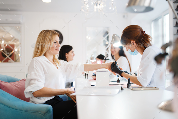 Group of girlfriends, manicure in beauty salon - Stock Photo - Images