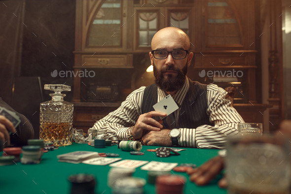 Bearded poker player show ace card, casino - Stock Photo - Images