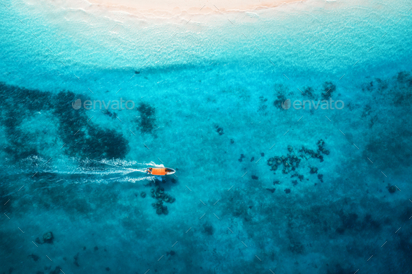 Aerial view of the fishing boats in clear blue water - Stock Photo - Images