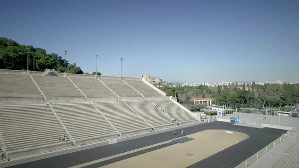 Aerial view of the Panathenaic, Kallimarmaro Stadium and the city skyline. alt