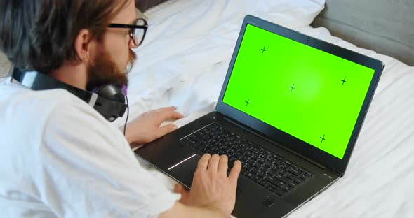 Man Laptop Green Screen Bed