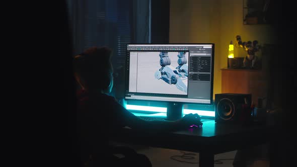 Teenager Creating 3D Model at Night alt