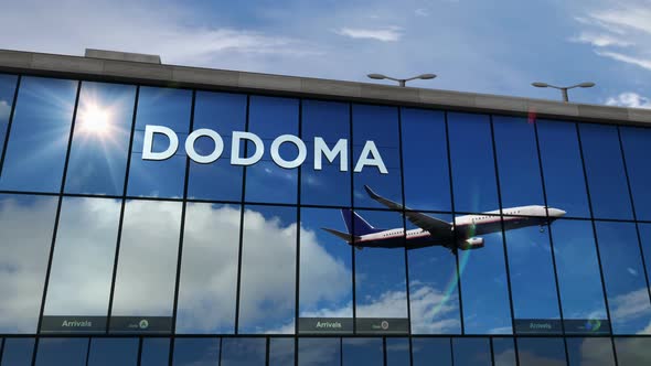 Airplane landing at Dodoma Tanzania airport mirrored in terminal alt