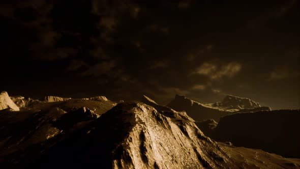 Dark Clouds Over Volcanic Valley with Grass and Rocks alt