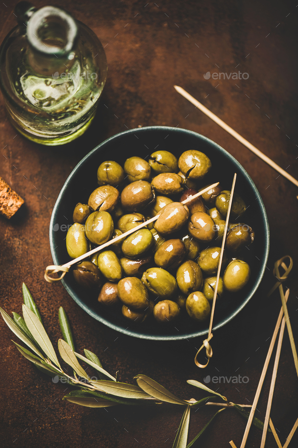 Flat-lay of fresh harvested seasonal pickled green Mediterranean olives - Stock Photo - Images