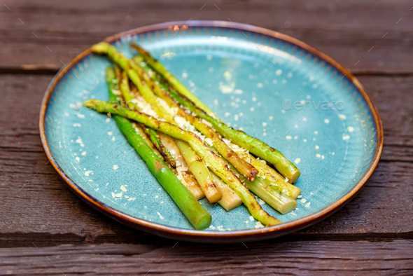 Close up delicious grilled asparagus on plate - Stock Photo - Images