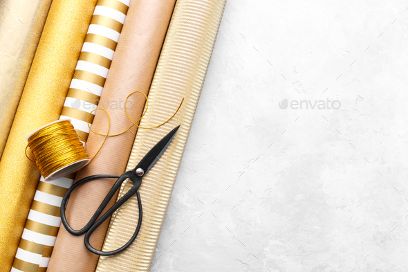 Golden wrapping paper rolls - Stock Photo - Images