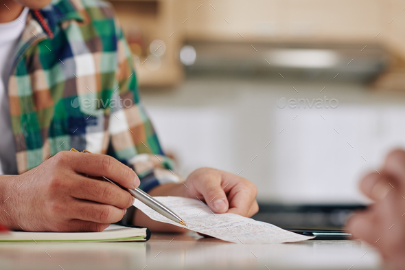 Family discussing bills - Stock Photo - Images