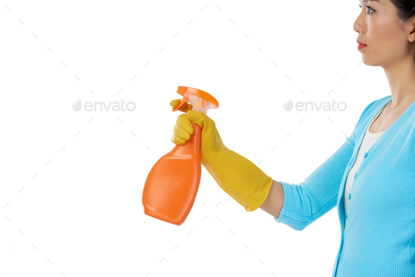 Pretty Woman Using Spray Cleaner - Stock Photo - Images
