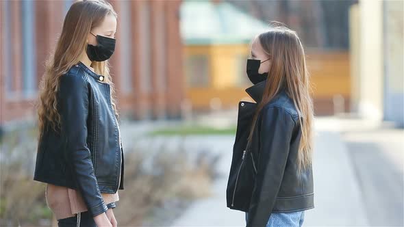 Girls Wearing a Mask on a Background of a Modern Building, alt