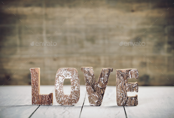 Valentine\'s Day concept. Love wood letters on table. Love wood letters close up.