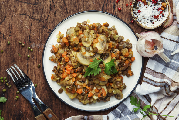 Cooked green Lentils with mushrooms and vegetables - Stock Photo - Images