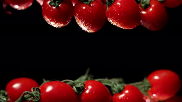 Cherry Tomatoes with Water Splash Drops at a Dark Background alt