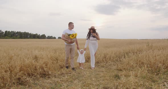 Young Parents Teach Their Baby To Walk