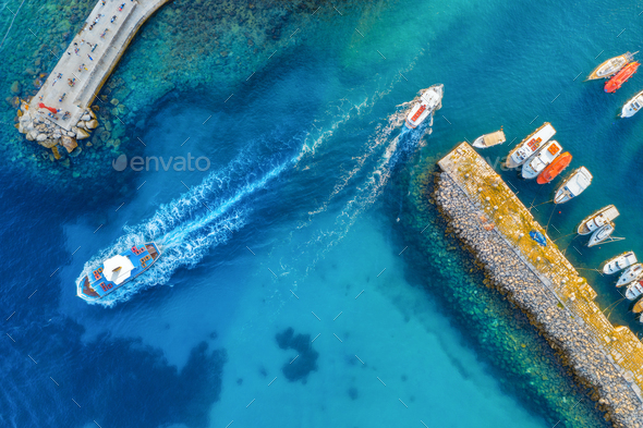 Aerial view of colorful boats and yachts in port in blue sea - Stock Photo - Images