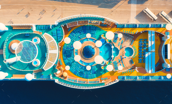 Aerial view of swimming pool, sunbeds, umbrellas on cruise ship - Stock Photo - Images