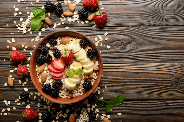 Flat lay top view at Fruit healthy muesli with banana strawberry almonds - Stock Photo - Images