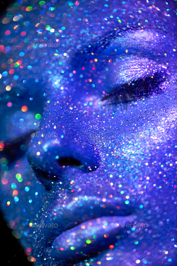 Portrait of beautiful woman with sparkles on her face - Stock Photo - Images