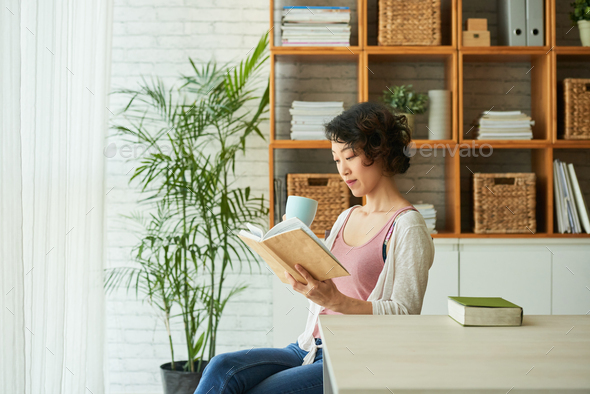 Wrapped up in Reading Novel - Stock Photo - Images