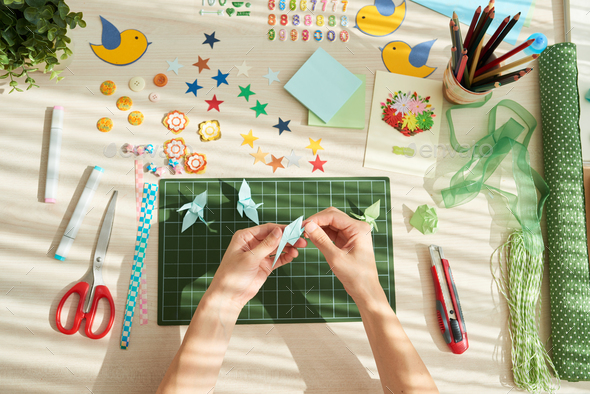 Creation of Origami Cranes - Stock Photo - Images