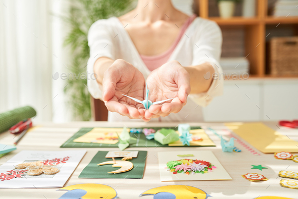 Talented Craftswoman with Origami Crane - Stock Photo - Images
