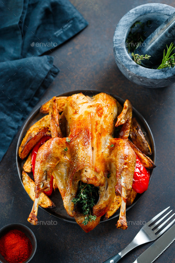 Roasted guinea fowl with herbs - Stock Photo - Images