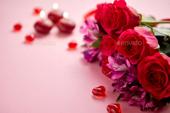 Mixed flowers bouquet with roses, candles and heart shaped acrylic decorations - Stock Photo - Images