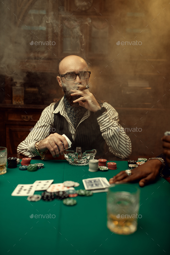 Bearded poker player with cigar, casino - Stock Photo - Images