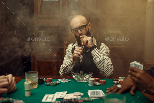 Bearded poker player with cigar, casino - Stock Photo - Images