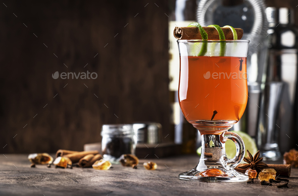 Hot rum punch, autumn or winter warming alcoholic cocktail - Stock Photo - Images