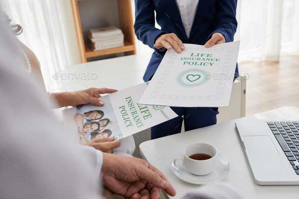 Discussing Life Insurance Program with Agent - Stock Photo - Images