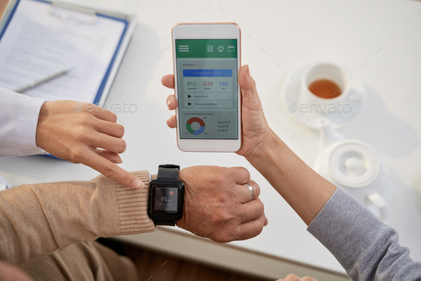 Physician Consulting Senior Patients - Stock Photo - Images