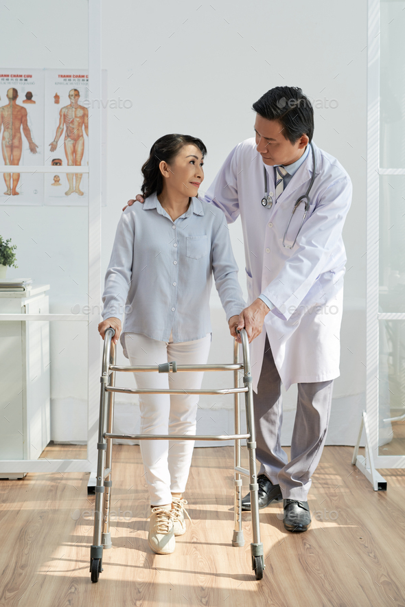 Asian Physiotherapist with Patient - Stock Photo - Images