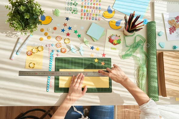Young Woman Wrapped up in Scrapbooking - Stock Photo - Images
