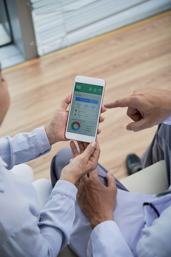 Senior Patient Using Health Monitoring App - Stock Photo - Images