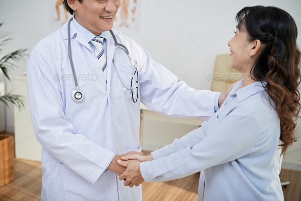Receiving Good News from Doctor - Stock Photo - Images
