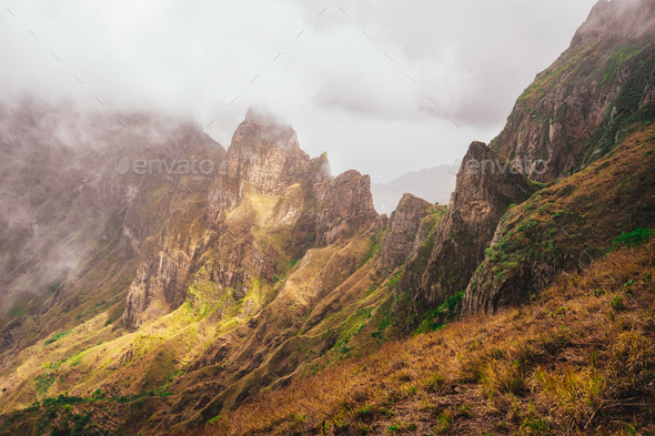 Santo Antao, Cape Verde. Mountain tops covered in fog and lit by the sun light in Xoxo in the - Stock Photo - Images