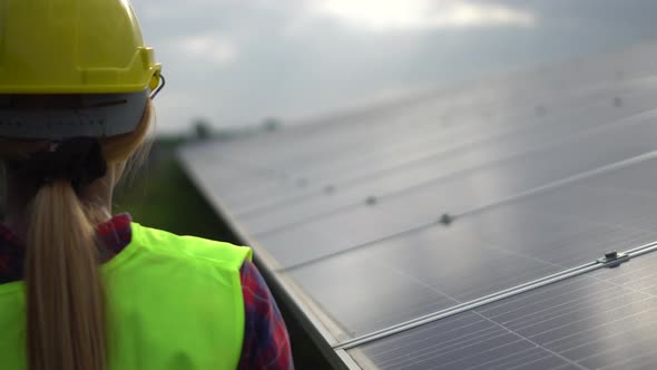 Aerial view of Engineering checking Solar cell Farm, Electricity production from the sun, alt